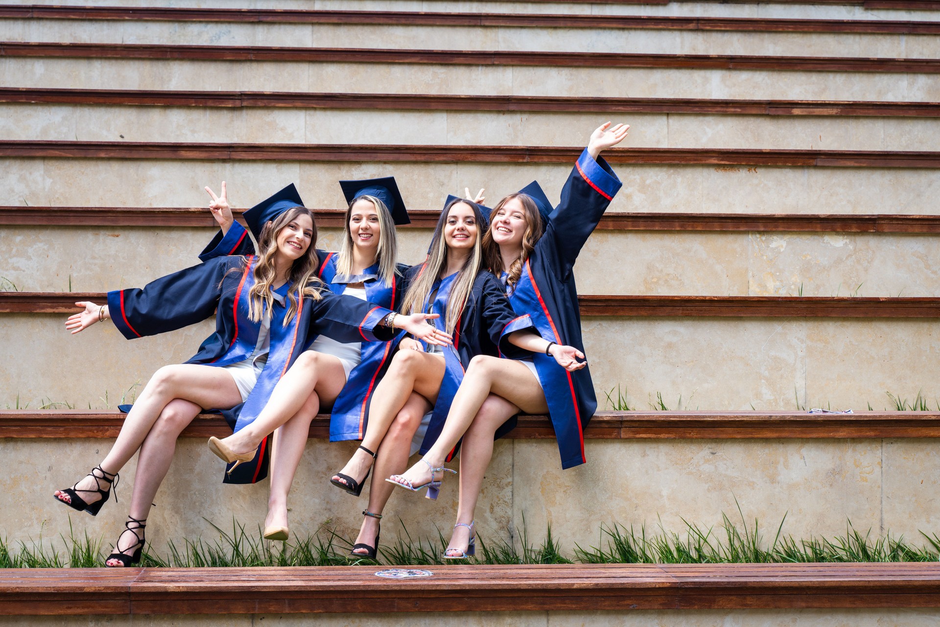 female friends group takes joyful photo after graduation