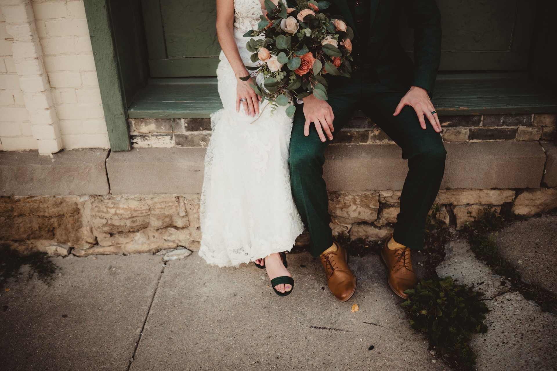 Stylish bride and groom in suit and wedding dress